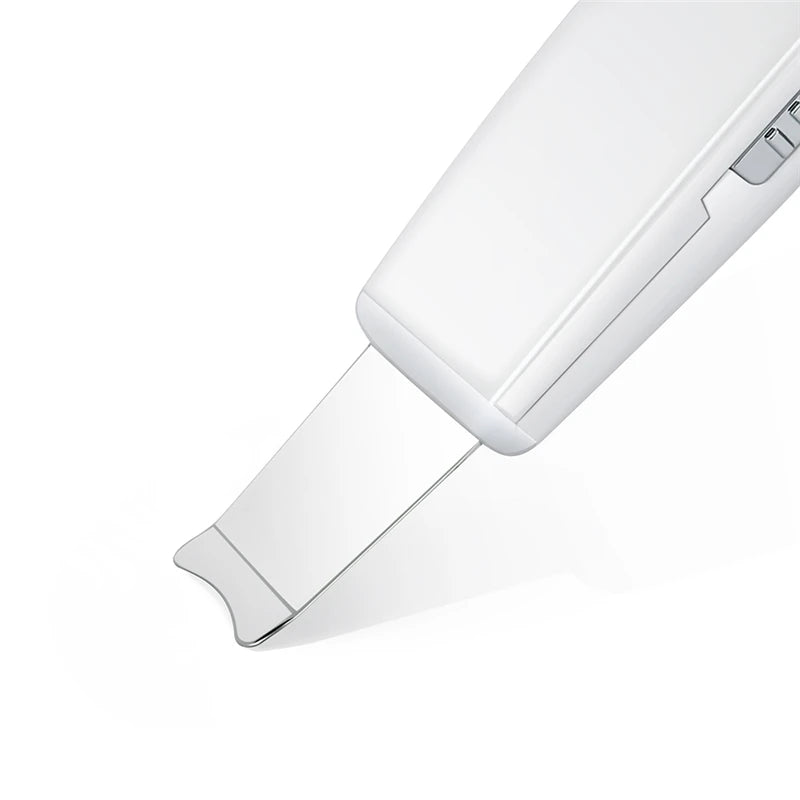 Close-up of Sonic Clean Pro ultrasonic skin scrubber tip showing scraping blade and ion technology